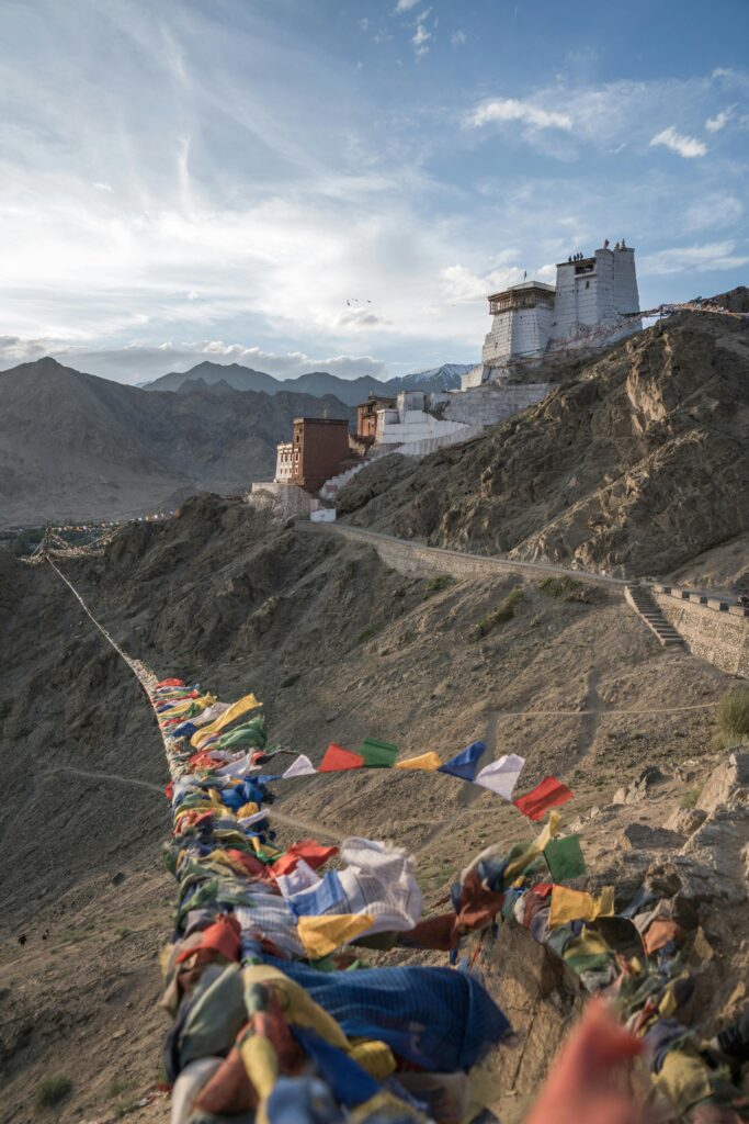 pexels-photo-5014924-5014924 Prayer Flags outside Namgyal Tsemo Monastery in India